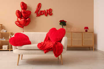 Interior of stylish festive living room with heart-shaped balloons and roses bouquet. Valentine's Day celebration