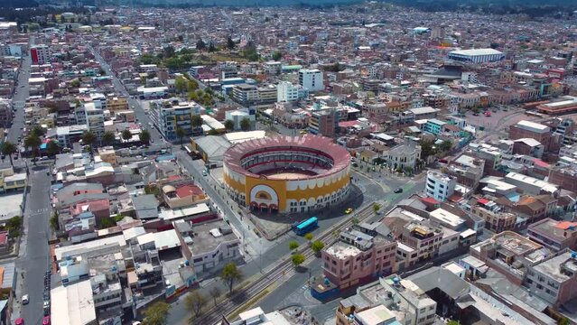Cityscape with ancient bullfighting arena in Ecuador_drone shot