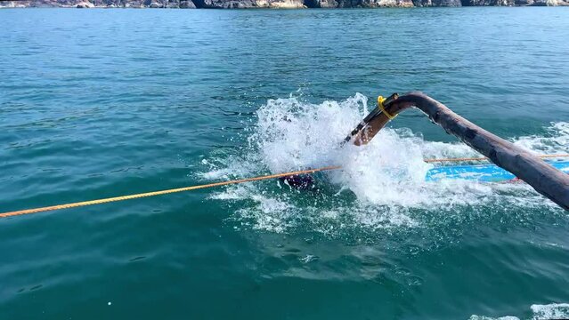 Close up shot of fast moving oar of traditional fishing boat Goa India 4K