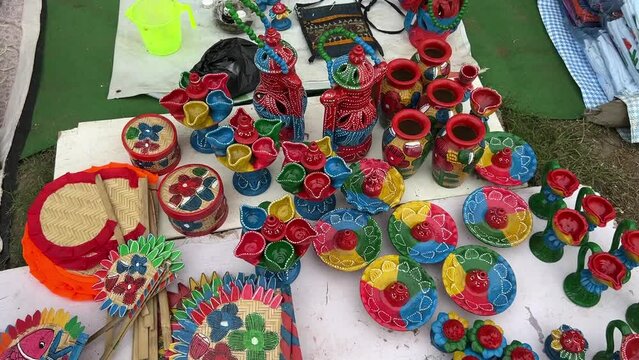 handmade clay diyas and jute fans displayed at an exhibition in Purulia, India
