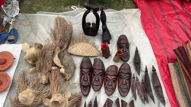 Handicraft wooden tribal facemasks at a roadside stall in Purulia, India