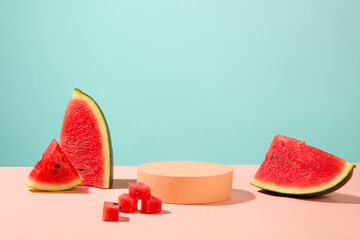 Watermelon cut in cubes and slices displayed with a podium in round shaped. Glamour minimal pedestal for beauty, cosmetic product presentation of Watermelon extract