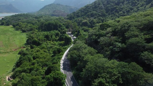 Drone shot of Pollachi To Valparai scenic route road trip near Aliyar Reservoir and Dam, Coimbatore, Tamil Nadu, South India