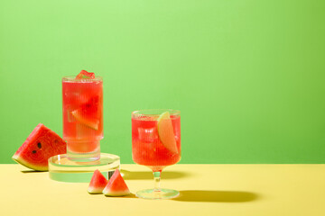 Watermelon juice is stored in glasses with a green background. Watermelon helps reduce inflammation effectively because it contains lots of vitamin C and lycopene