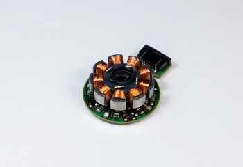 A DC electric motor stator with copper wire coil