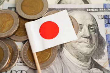 Japan flag on coins background, finance and accounting, banking concept.