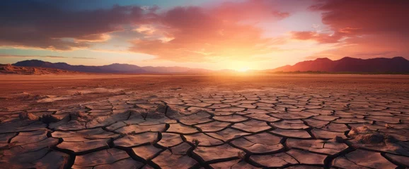 Cercles muraux Marron profond Global warming concept.Soil drought cracked landscape on sunset sky.Dry cracks in the land, serious water shortages.Drought concept. 