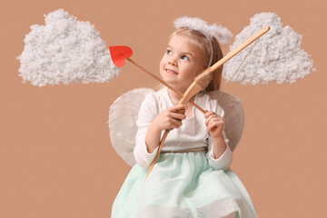 Cute little girl dressed as cupid with bow, arrow and clouds on brown background. Valentine's Day...