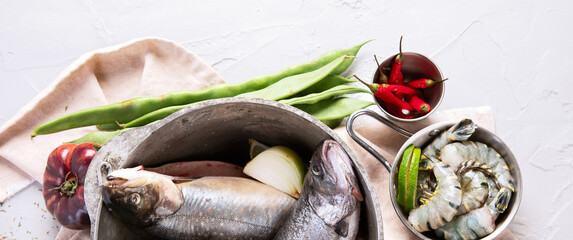 Fresh fish and ingredients for cooking. Raw fish.