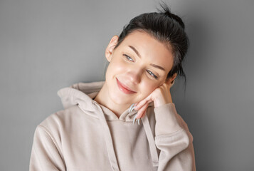Portrait of a young pretty girl in a  hoodie