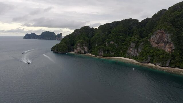 Drone footage from PhiPhi islands in Thailand footage of incredible Thai landscapes incredible nature with insane rocks, beaches, hills, ocean adn boats. Footage. filmed in 4k