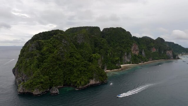 Drone footage from PhiPhi islands in Thailand footage of incredible Thai landscapes incredible nature with insane rocks, beaches, hills, ocean adn boats. Footage. filmed in 4k