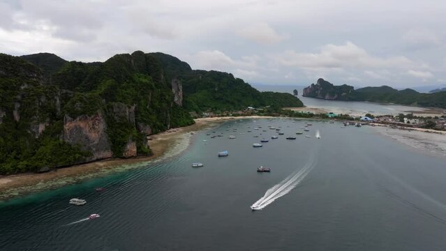 Drone footage from PhiPhi islands in Thailand footage of incredible Thai landscapes incredible nature with insane rocks, beaches, hills, ocean adn boats. Footage. filmed in 4k