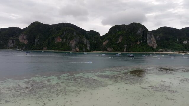 Drone footage from PhiPhi islands in Thailand footage of incredible Thai landscapes incredible nature with insane rocks, beaches, hills, ocean adn boats. Footage. filmed in 4k
