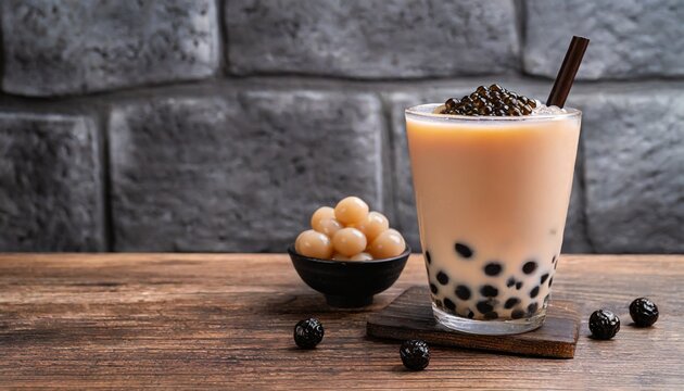 Bubble Burst: Close-Up Shot of Milk Tea and Tapioca Pearls on a Dark Gray Brick Wall