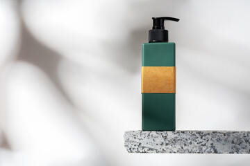 Cosmetic package dispenser with granite stone studio shot