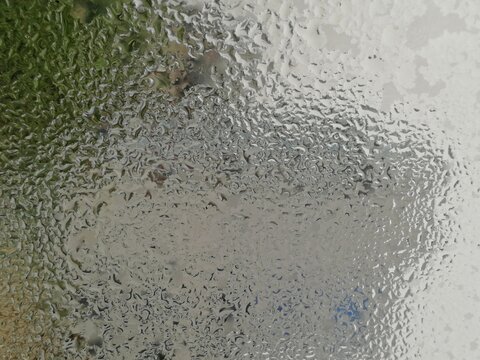 Raindrop background for sleeping, meditating, reading, or simply finding your calm inner peace during yoga. Eye soothing view of raindrops Condensation on window glass in the morning
