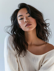 Young woman posing in front of clean background.Copyspace for text.