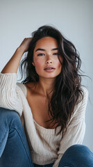 Young woman posing in front of clean background.Copyspace for text.