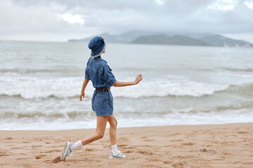 Summer Serenity: A Young Woman's Joyful Morning Jog along the Sunny Blue Shoreline
