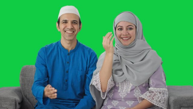 Happy Muslim couple doing Adaab Green screen