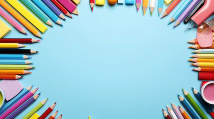 Fototapeta premium Frame of different stationery on light blue background, flat lay. Space for text, back to school