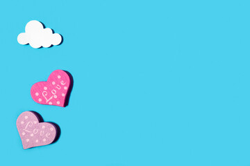 Wooden heart on a pastel blue background. Concept for Valentine's Day, World Women's Day, Mother's Day. Romantic flat composition..