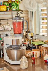 Fototapeta na wymiar Professional Chef Prepares Gazpacho in Blender at Home Kitchen with Expert Hands