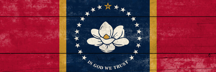 Mississippi State flag on a wooden surface. Banner of the grunge Mississippi State flag.