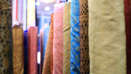 Rows of fabrics in a textile shop at Mayestik Market, Jakarta, Indonesia.
