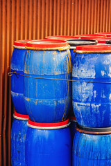 Blue plastic barrels at a warehouse