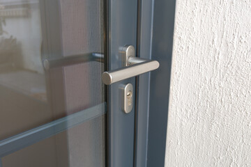 metal handle on the modern door house entrance on contemporary home