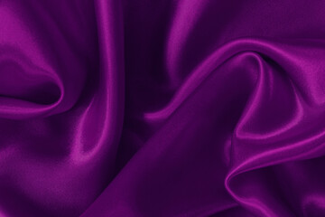 Dark purple fabric texture background, detail of silk or linen pattern.