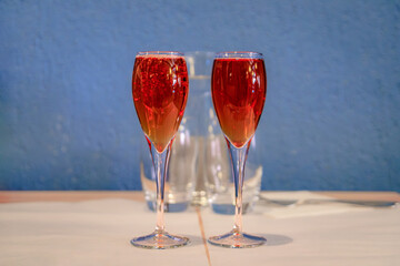 Two glasses of Kir Royale with Cremant sparkling wine and Creme de Cassis black currant liqueur at...