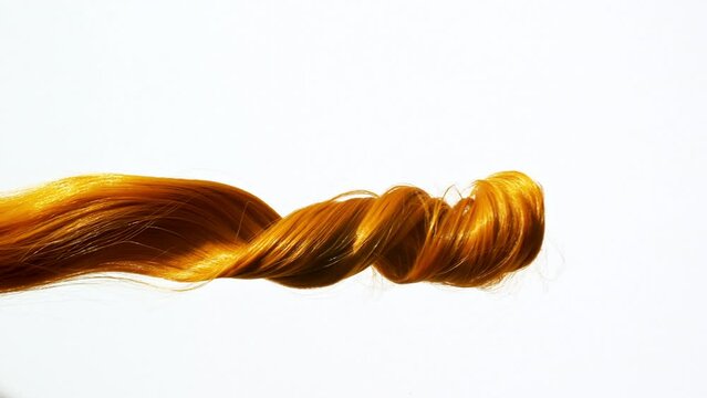 Waving of locks, bunch of brown, redheads shiny wavy hair. Slow Motion. Hair care and beauty salon. Natural cosmetic products. Hair color palette. . High quality 4k footage