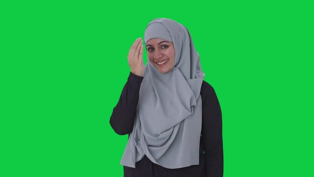 Happy Muslim woman doing Adaab Green screen