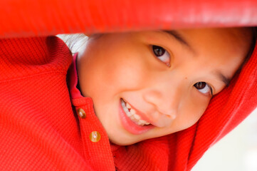 Head shot of Asian girl in red dress