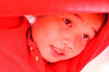 Head shot of Asian girl in red dress