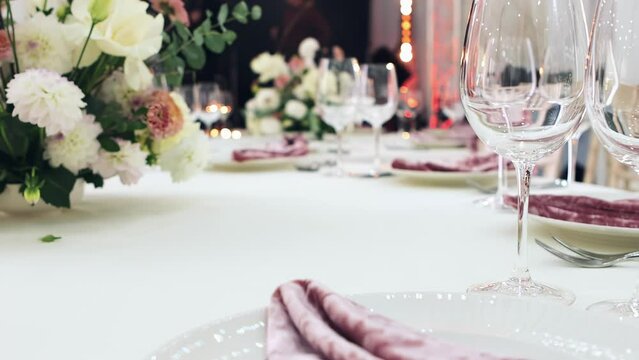 decorated wedding banquet table, wedding table for the wedding, wedding banquet preparation, festive table, cutlery, glasses