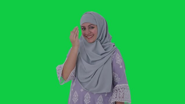 Happy Muslim woman doing Adaab Green screen