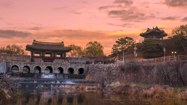 Time lapse, Banghwasuryujeong and Dongbukru in Hwaseong, Suwon with a beautiful sunset. Zoom in