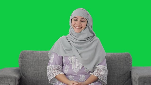Happy Muslim woman greeting with Adaab Green screen