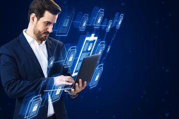 Attractive young european businessman using laptop with creative digital chain of documents on blue...