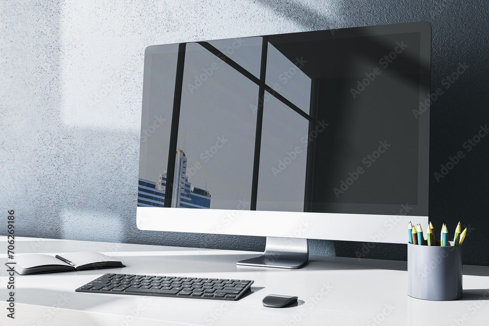 Poster contemporary designer office desktop with computer monitor and reflections, supplies and other items