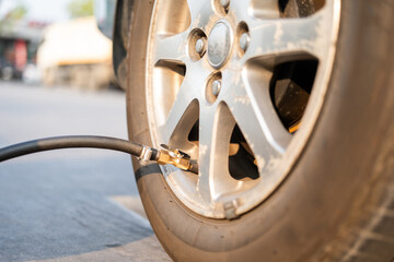 Fill Air station service for vehicle tires. Checking air pressure car wheels maintenance and safety