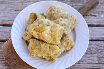 Cabbage rolls with meat, rice and vegetables. Stuffed cabbage leaves with  ground beef. Known as sarma, golubtsy, dolma.