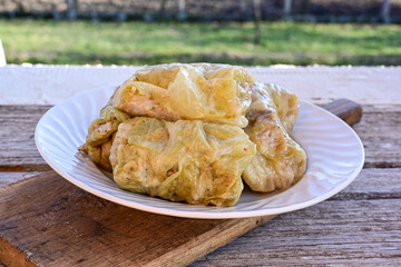 Cabbage rolls with meat, rice and vegetables. Stuffed cabbage leaves with  ground beef. Known as sarma, golubtsy, dolma.