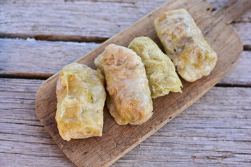 Cabbage rolls with meat, rice and vegetables. Stuffed cabbage leaves with  ground beef. Known as sarma, golubtsy, dolma.
