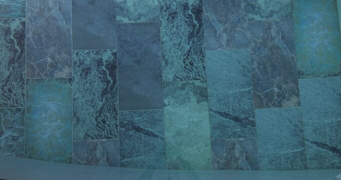 Background texture underwater blue color marble pattern tiles for swimming pool concept