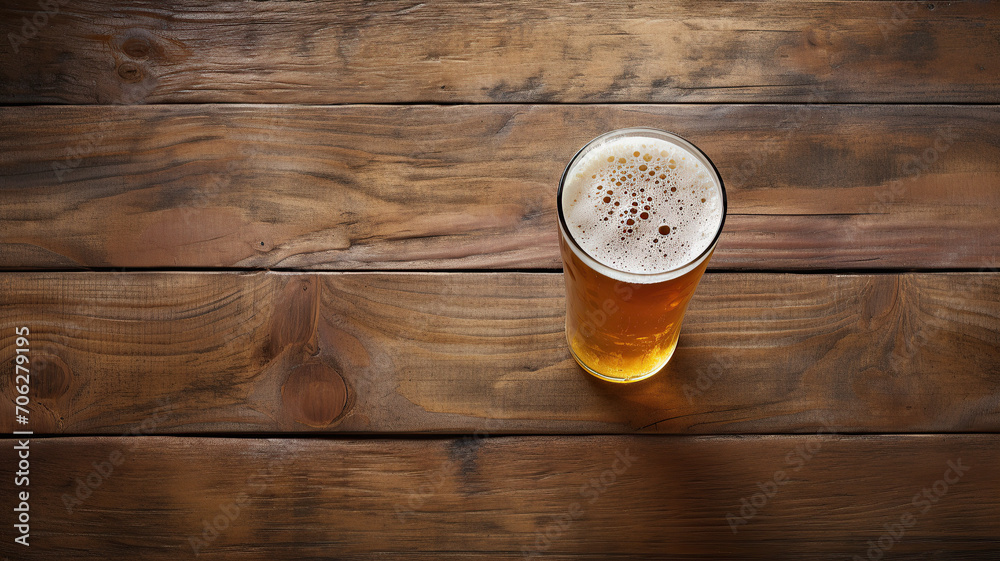 Wall mural close up image from above of a pint of beer on a wooden table ai generated